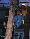 Sean Golden at work on the phone pole